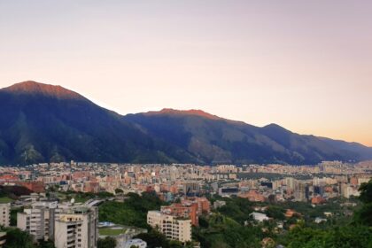 a view of a city with mountains in the background