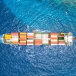 An aerial view of a cargo ship in the ocean