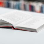 opened book on white surface