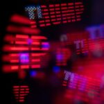 Red and blue abstract bokeh lights forming the word trump