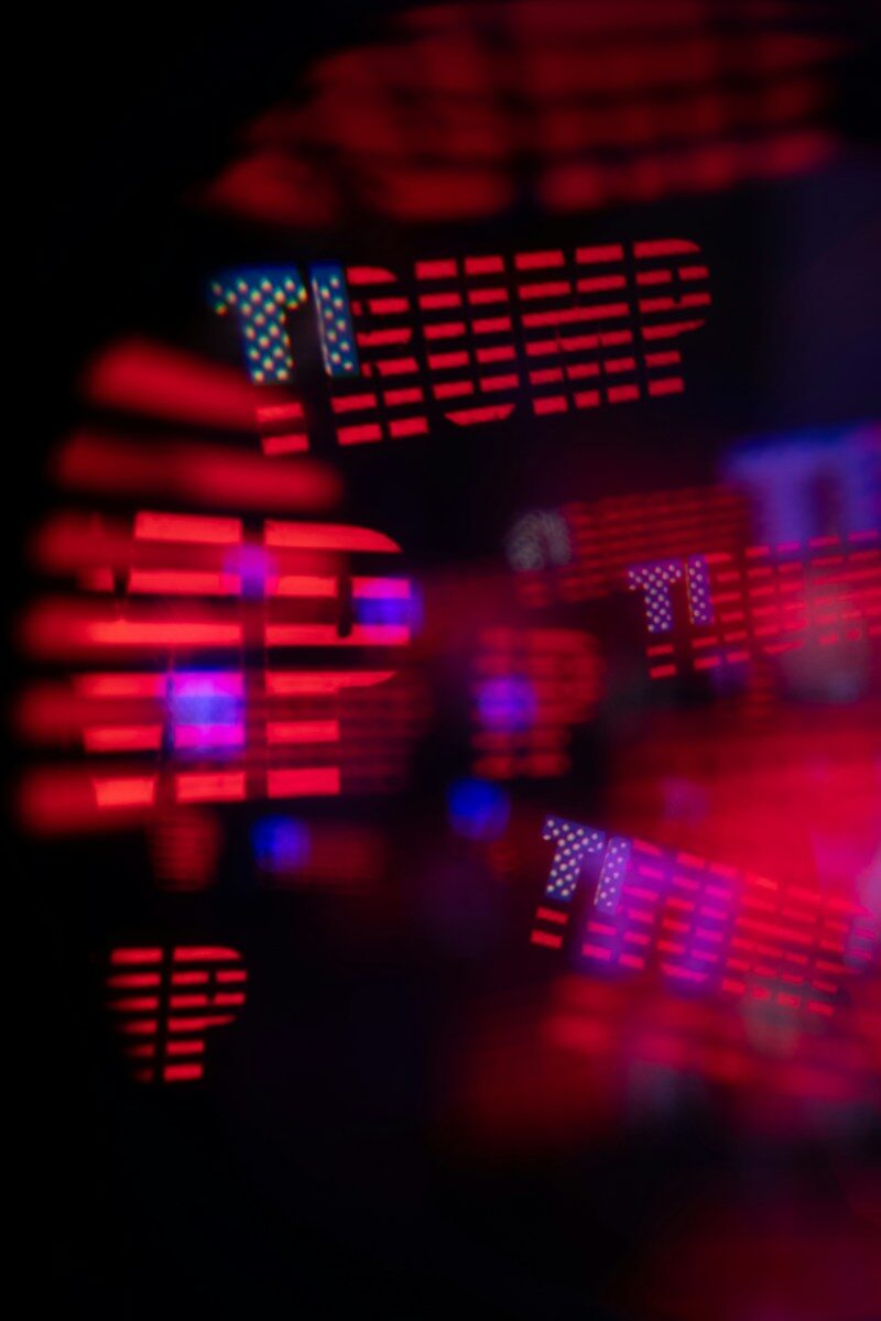 Red and blue abstract bokeh lights forming the word trump